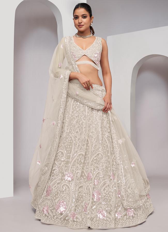 Soft Net Off White Wedding Wear Sequins Work Lehenga Choli